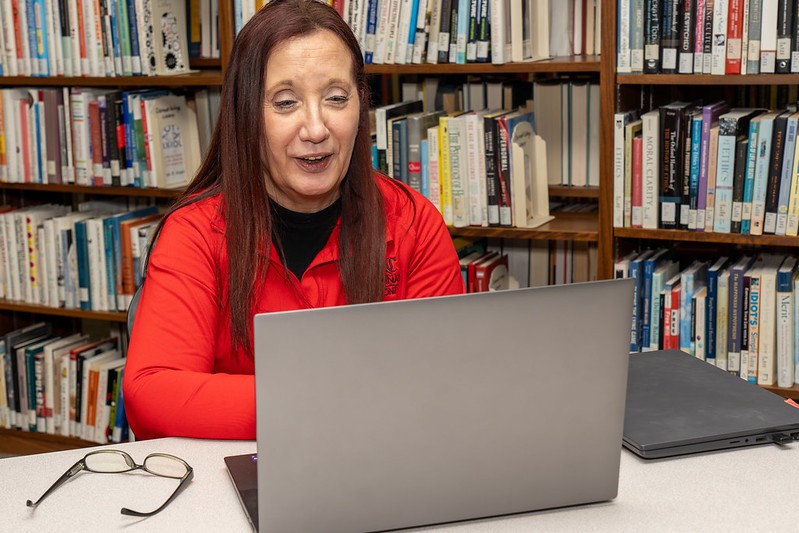 tutor leading a review session with two students
